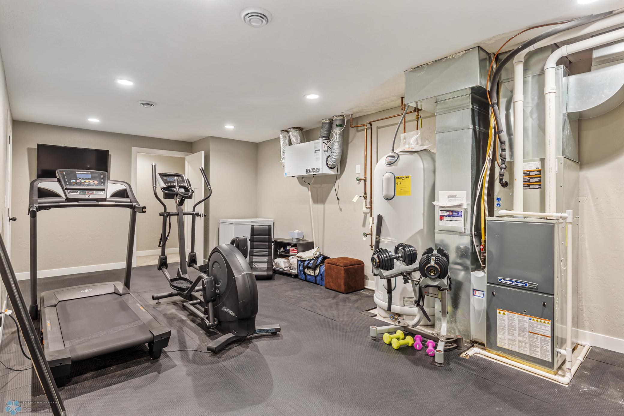 Huge storage/workout/utility room with w/in storage closet