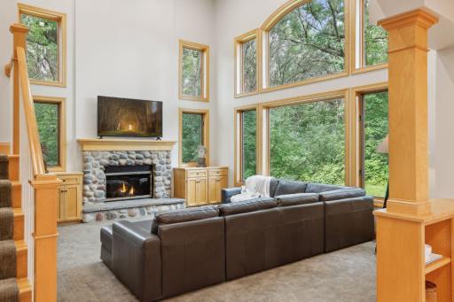 Great Room with wood-burning fireplace and soaring ceilings
