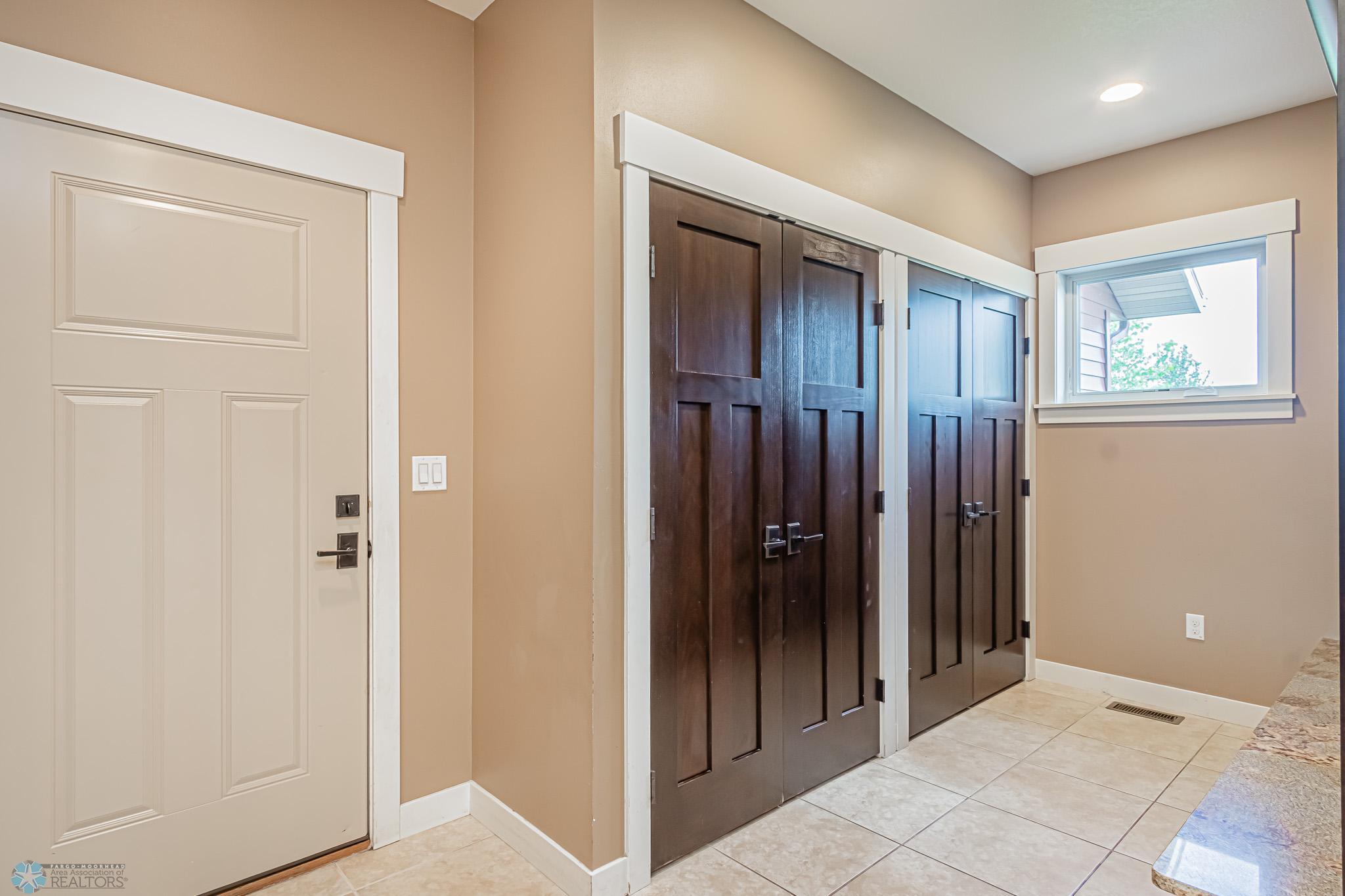 Double Closets by Garage Entry