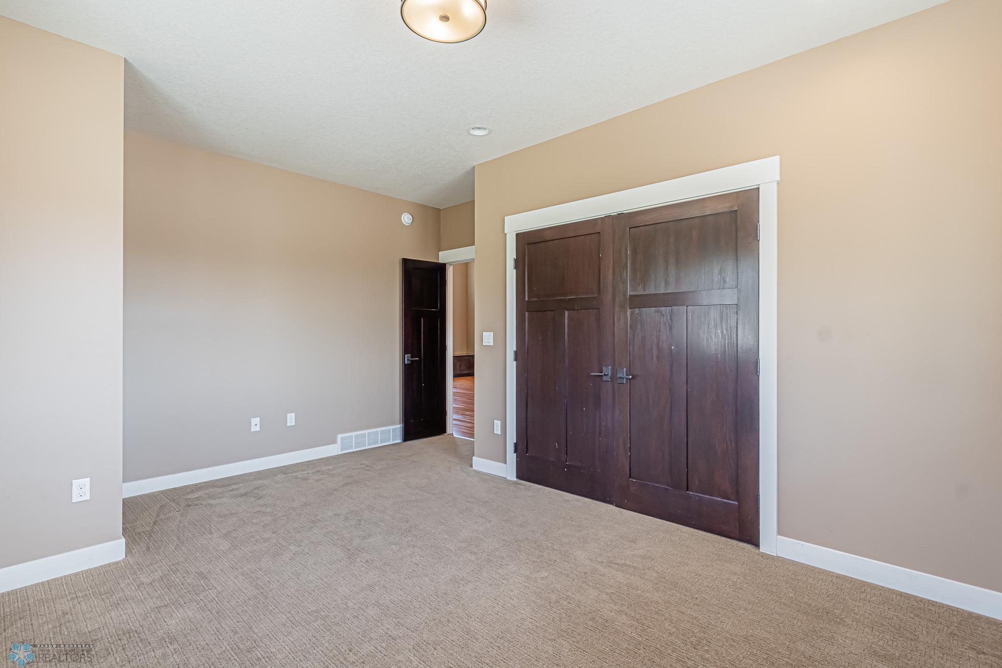 Main floor Bedroom or serves as a great Home office!