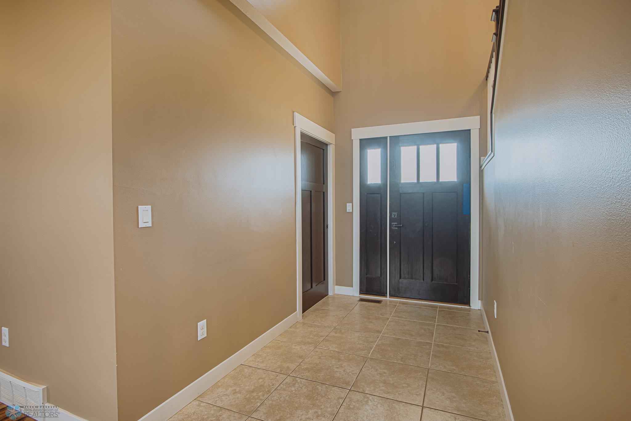 Front Entry & Front closet; Solid Core Doors & Tiled Flooring