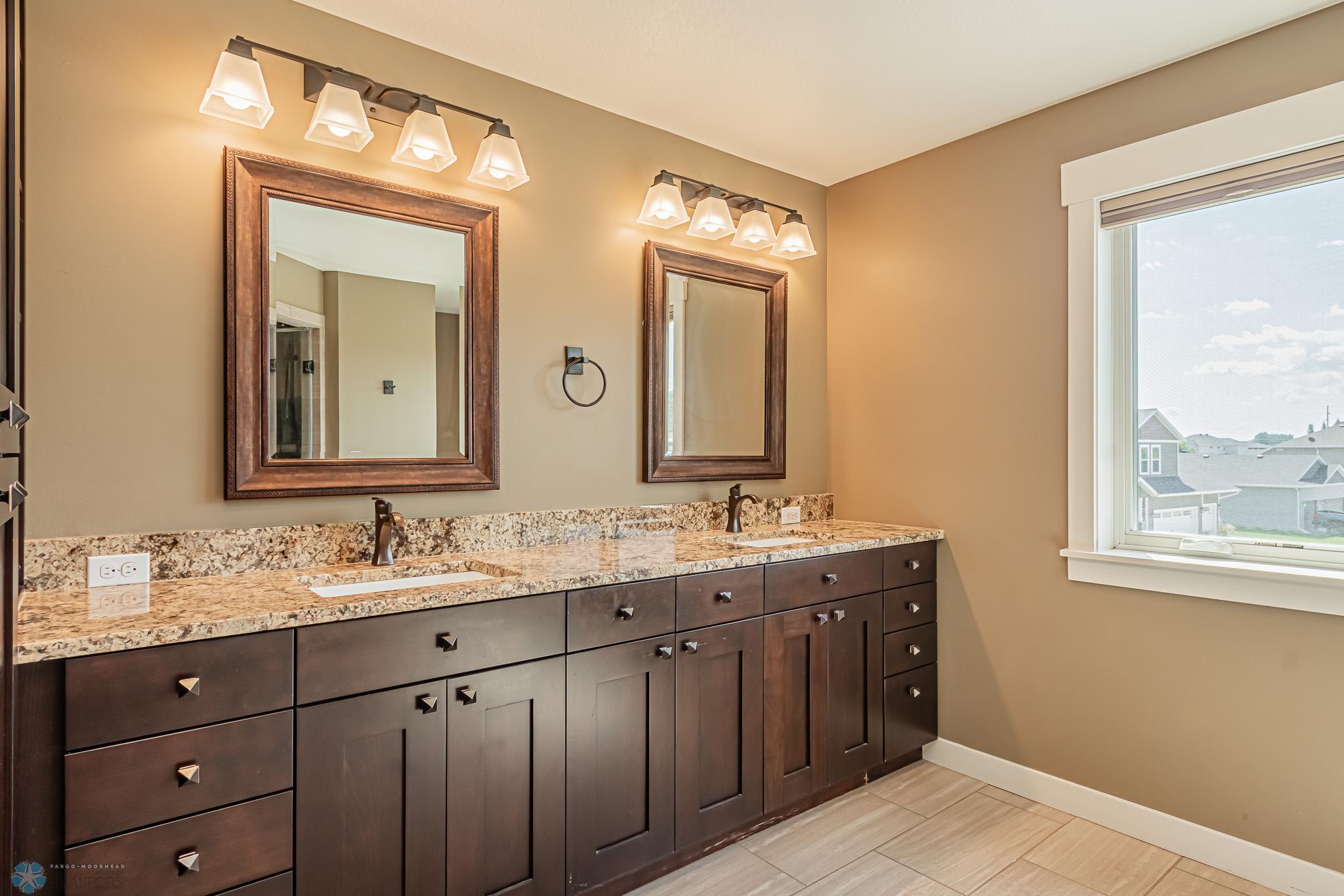 Primary Bath with DBL sinks, heated Tile Floor , Custom Steam SHWR & separate Toilet area