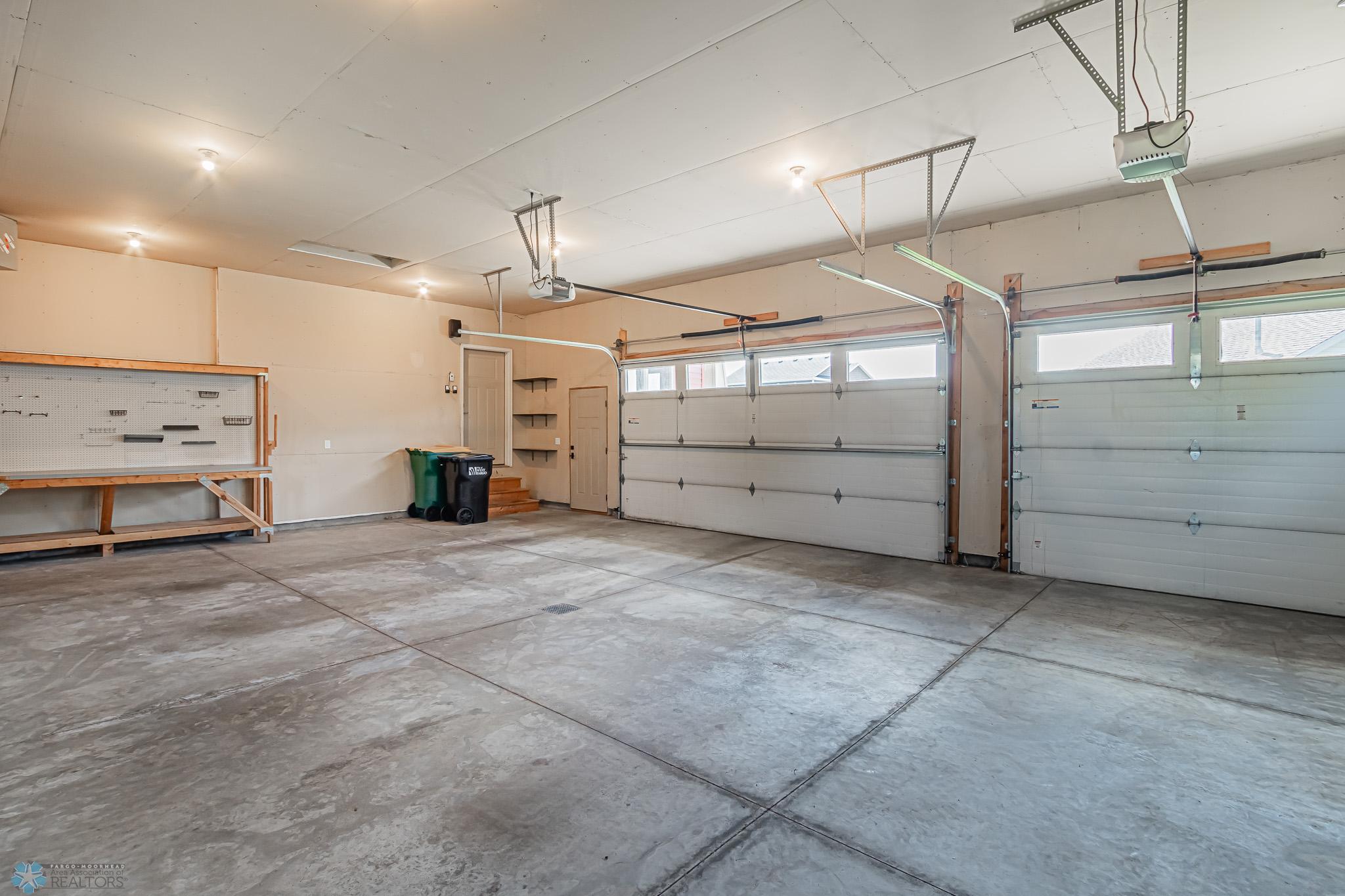 Over-sized 3 Stall Garage with Floor Drain & Gas Heater