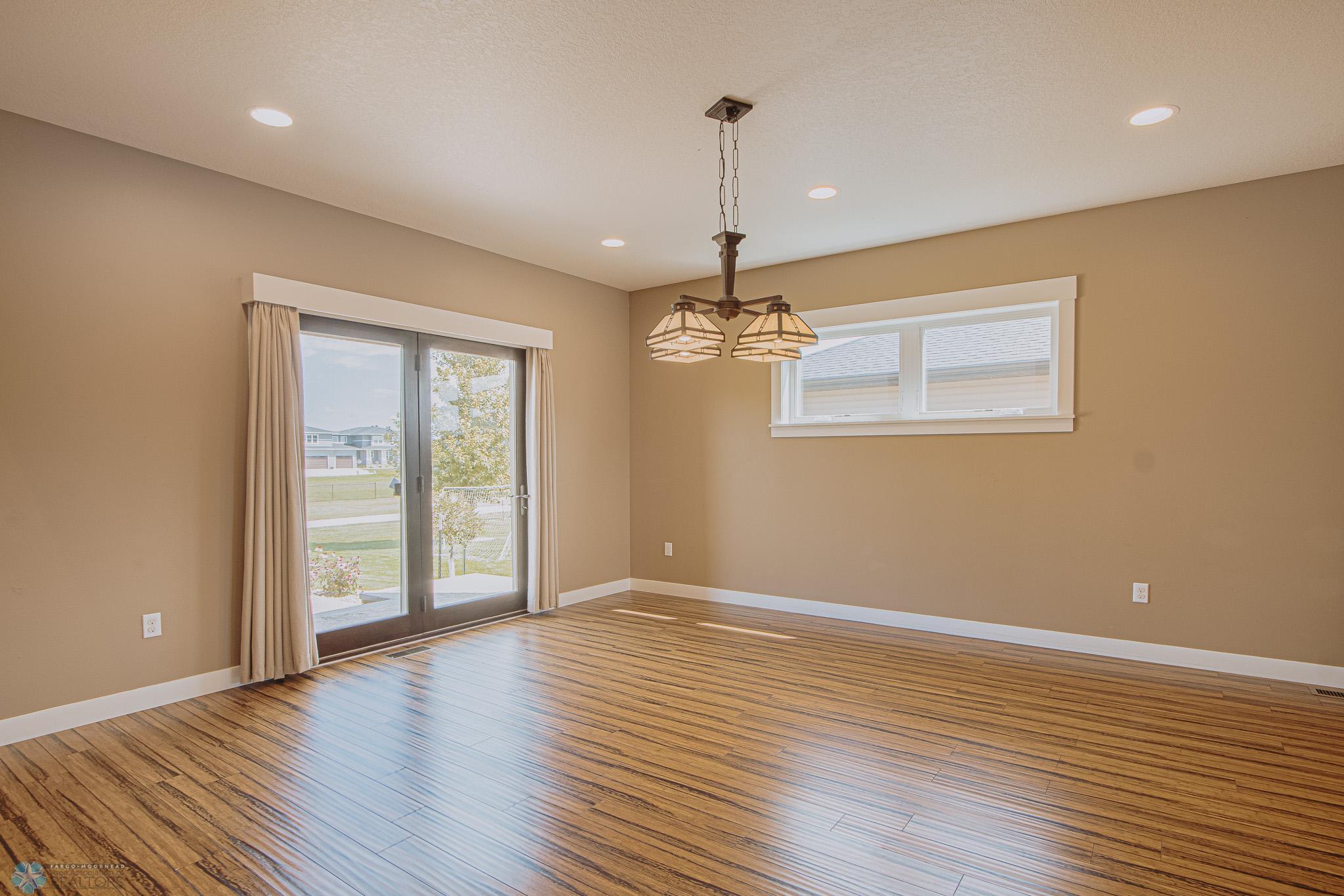 Large Dining Space with access to backyard & 3-level stamped concrete patio