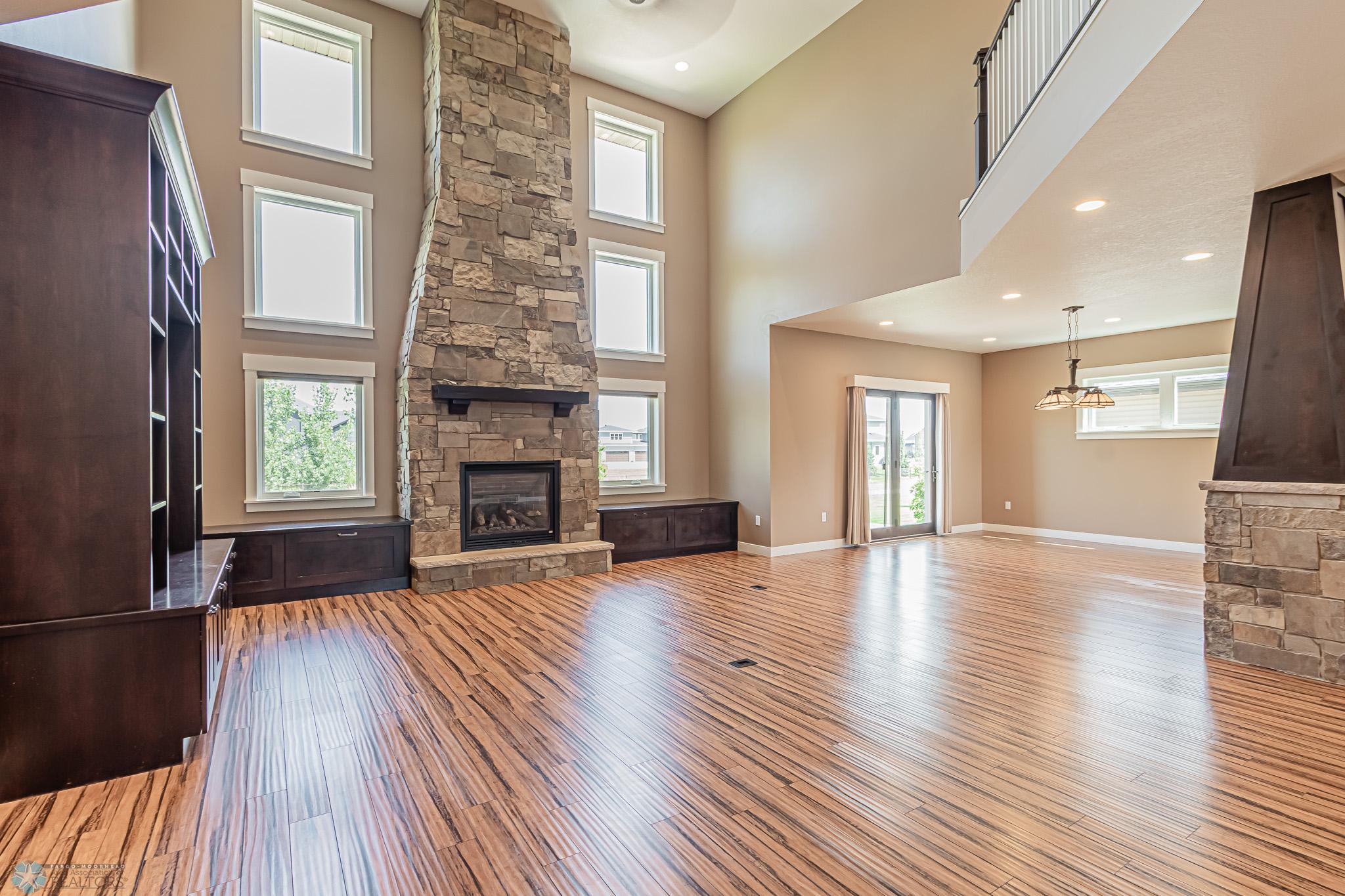 Abundant Windows Cascade natural lighting throughout the home! Gas Fireplace soars to 2nd story!