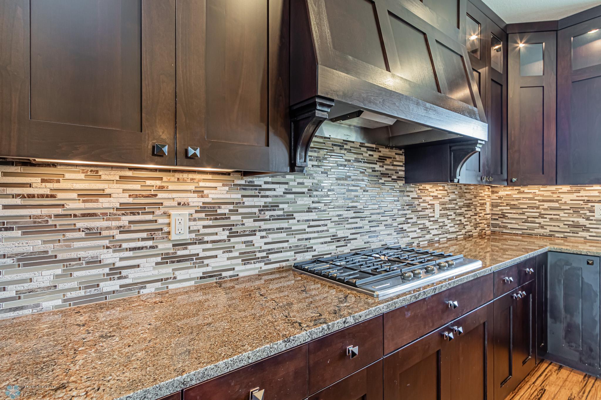 Exterior Vented 5-Burner Gas Cooktop, Granite Countertops & beautiful Tiled Backsplash!