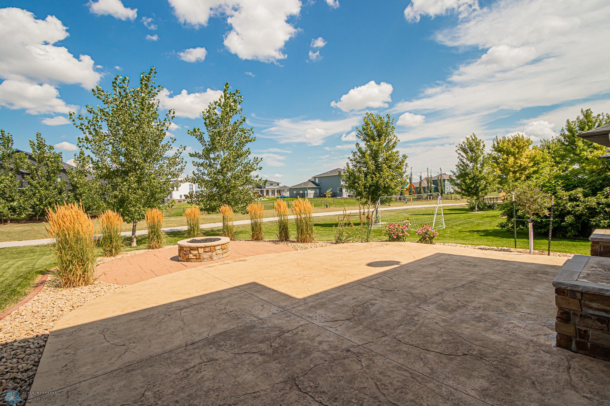 3-Level Stamped Concrete Patio with Gas Firepit!