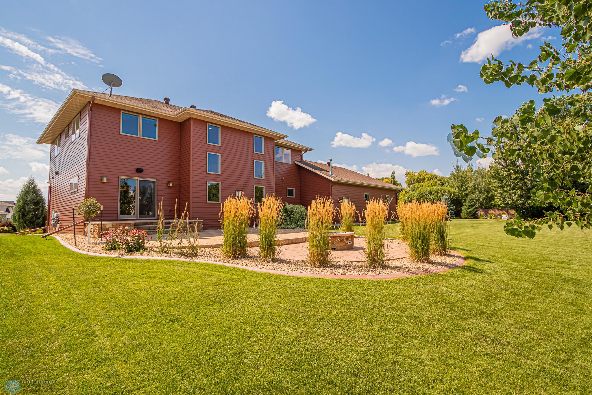 Fully-Landscaped yard includes curb edging, Perennials & Sprinkler system