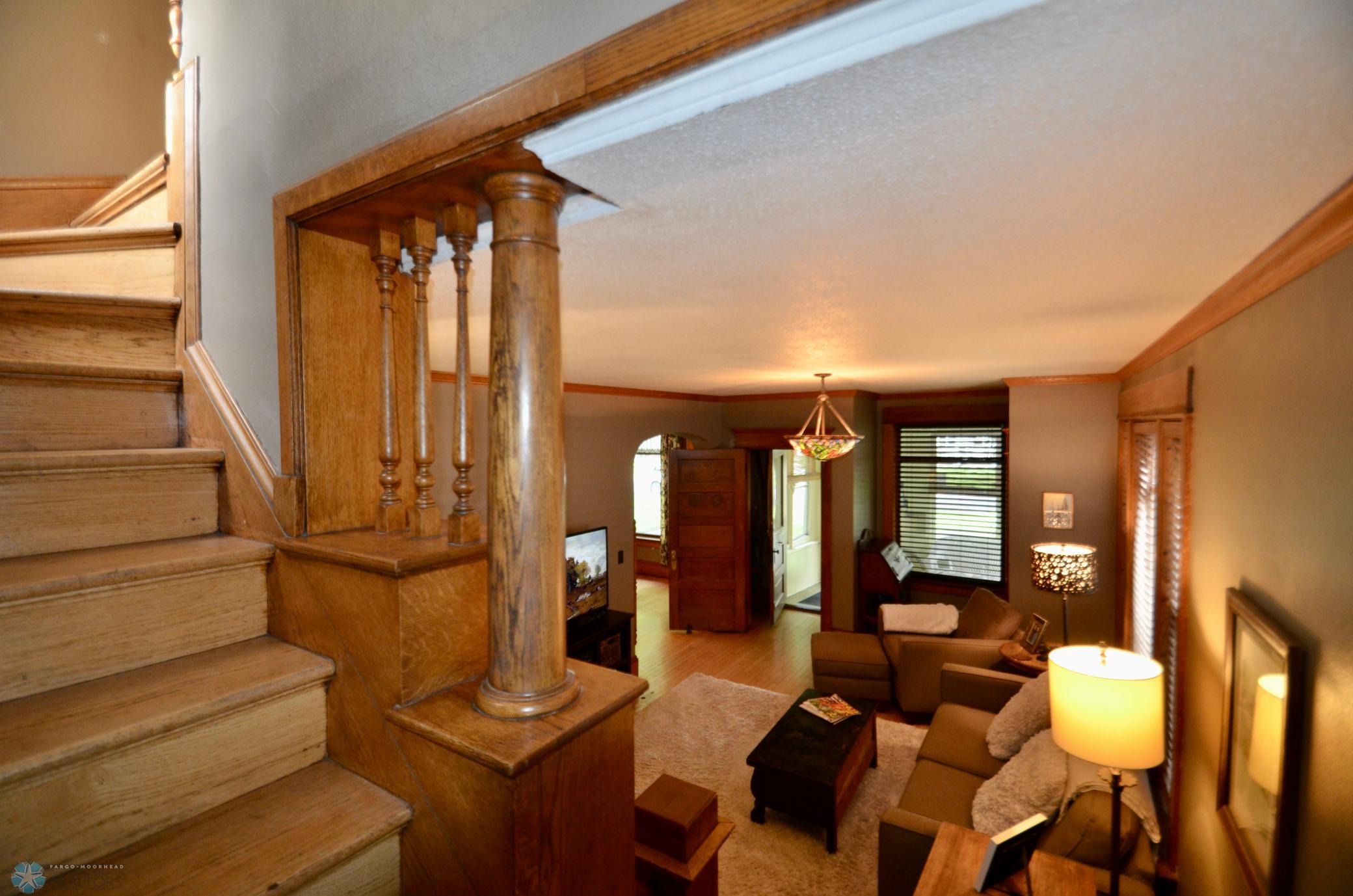 Stairway overloods cozy living room