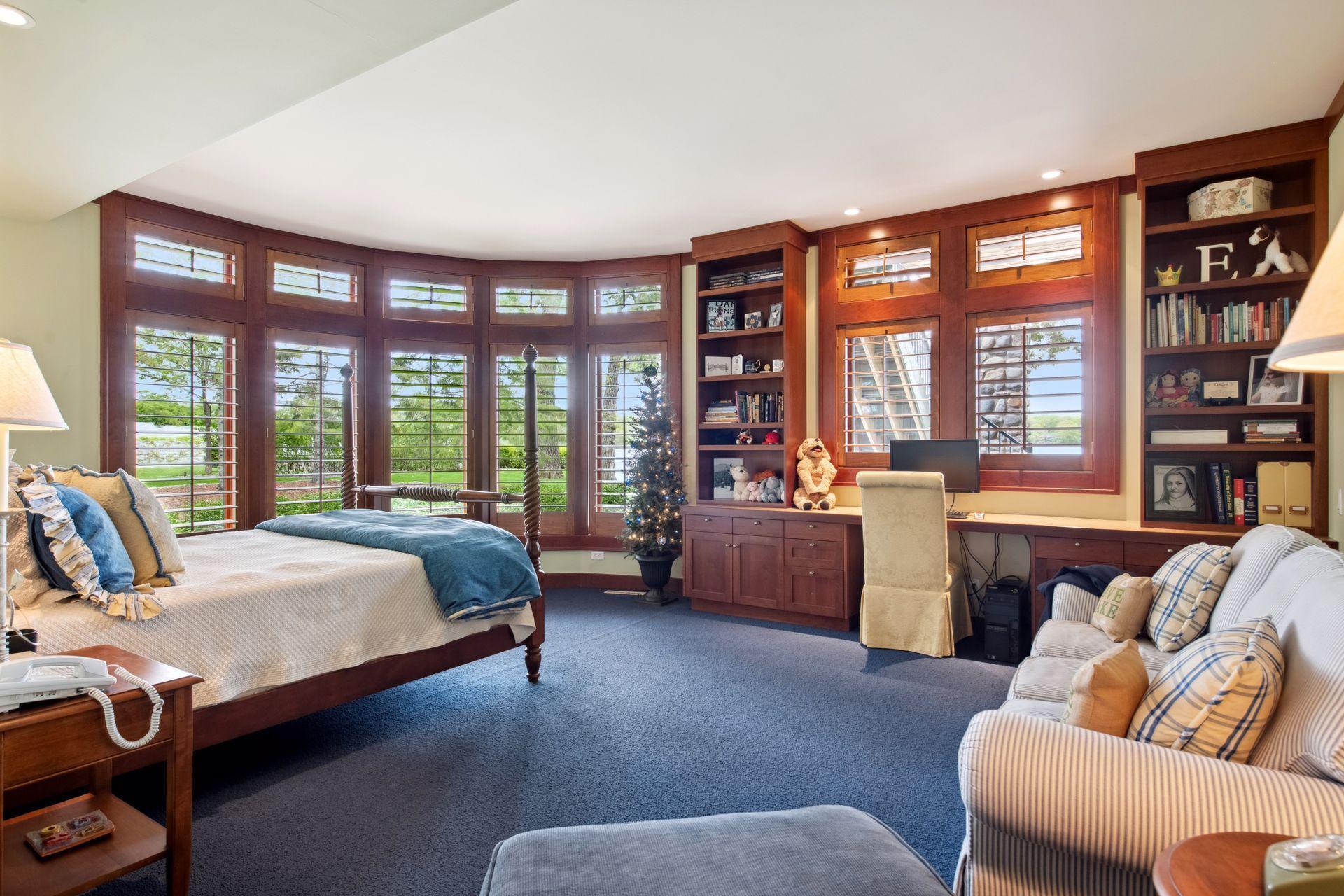 Bedroom three en suite in lower level again facing the lakefront for water views. This room is large enough to accommodate a couch, armchair with ottoman and more. Lovely built in desk area for kids to do homework, study or read a book.