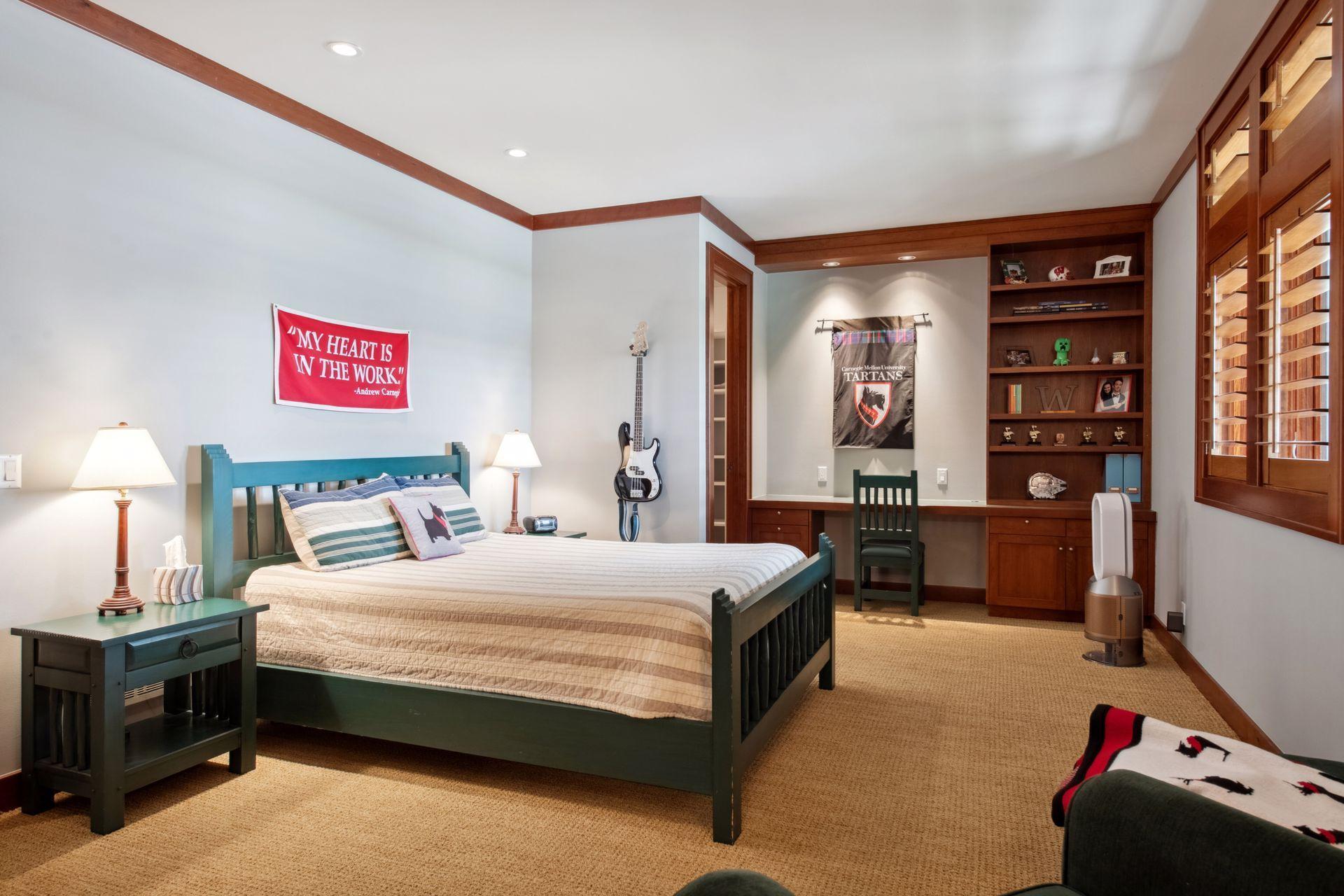 Bedroom two en suite facing water with built in wall desk area, large walk in closet and 3/4th bath.