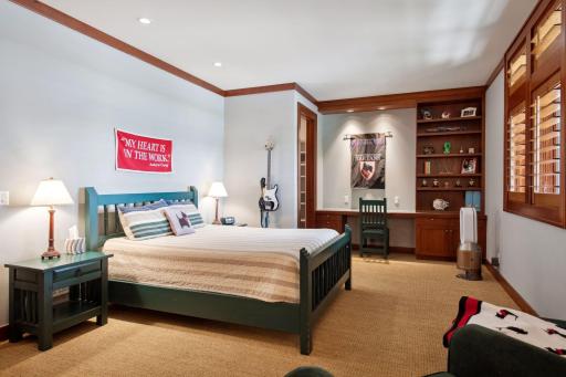 Bedroom two en suite facing water with built in wall desk area, large walk in closet and 3/4th bath.