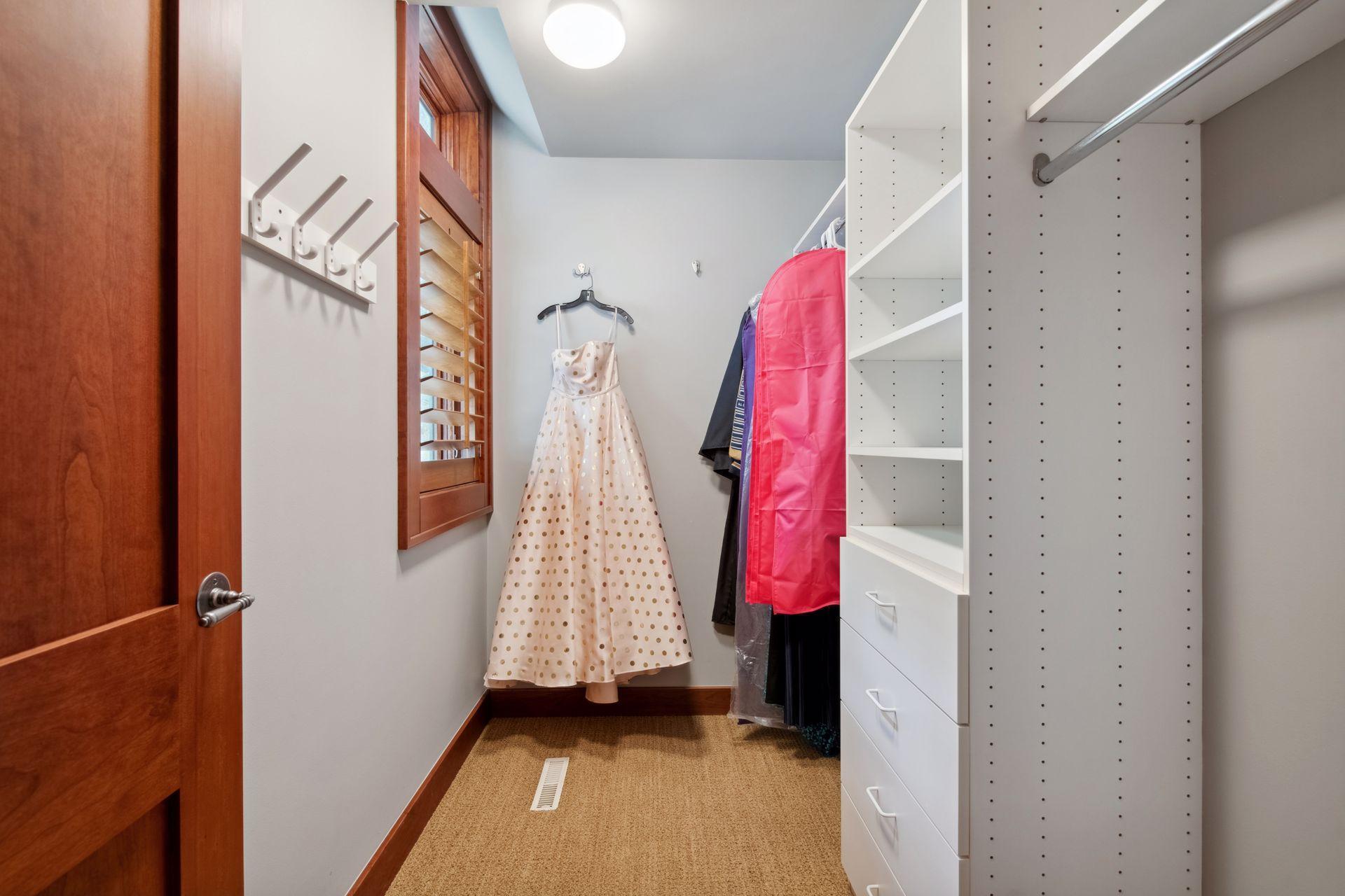 Large walk in closet to en suite bedroom one in lower level.