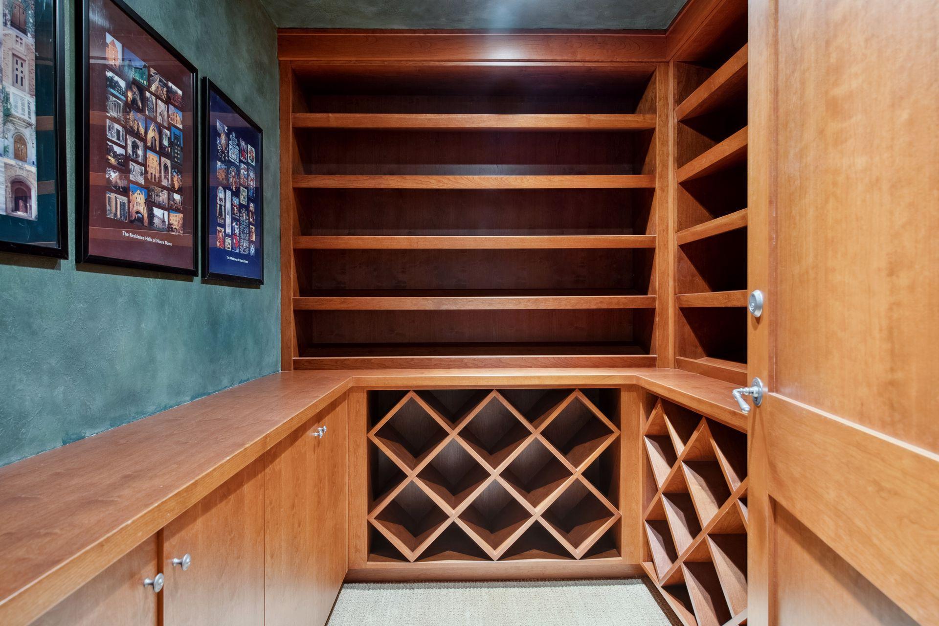 Additional storage room or wine room located in hall by bedrooms. An outlet can be added for ease behind front left lower door for access to add a refrigerator.