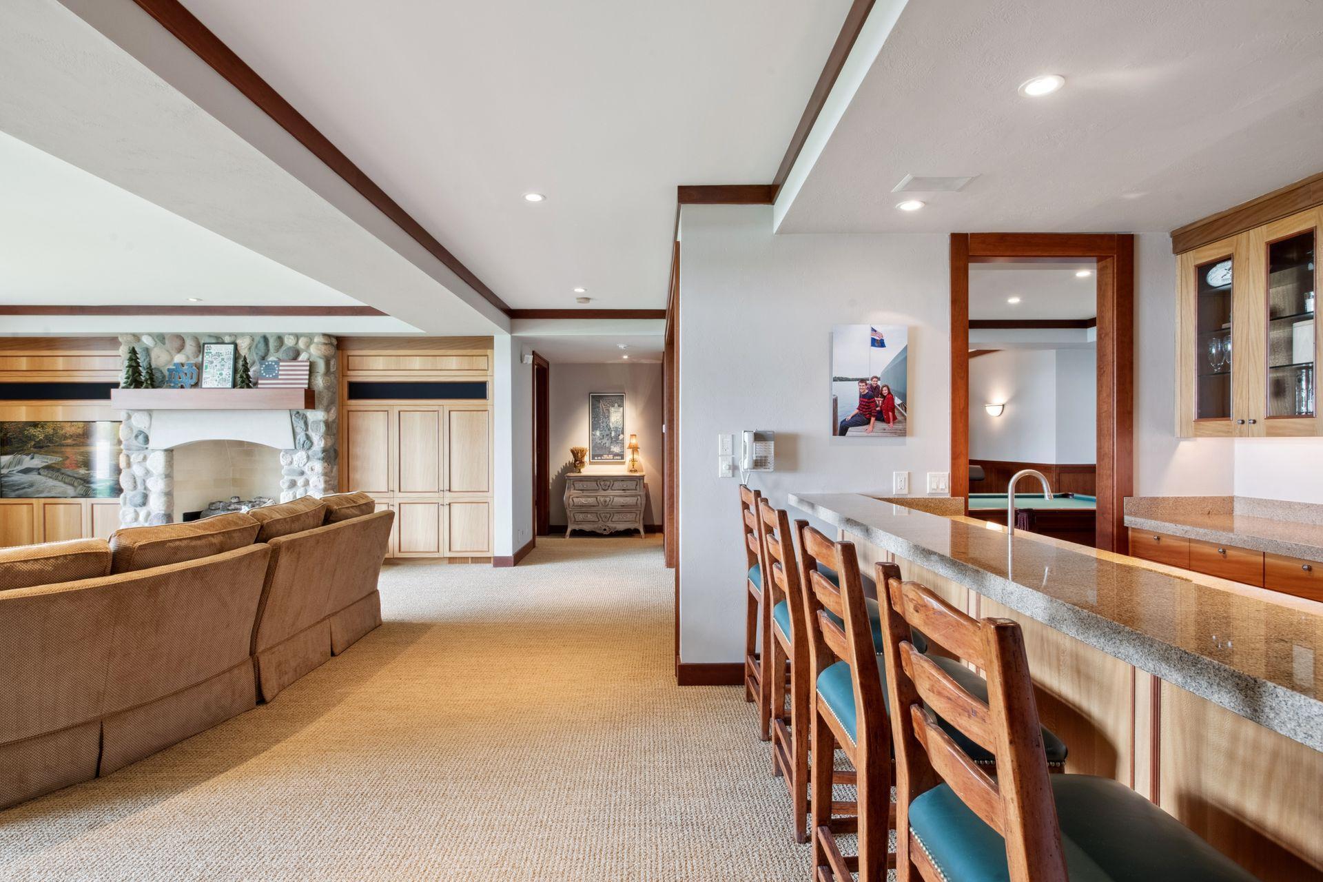 When you enter the lower level you have two wings. (Turn left or right) Both wings have en suite bedrooms that face the water. Straight a head is the entrance to the large guest suite (see next photo)