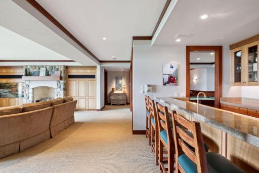 When you enter the lower level you have two wings. (Turn left or right) Both wings have en suite bedrooms that face the water. Straight a head is the entrance to the large guest suite (see next photo)