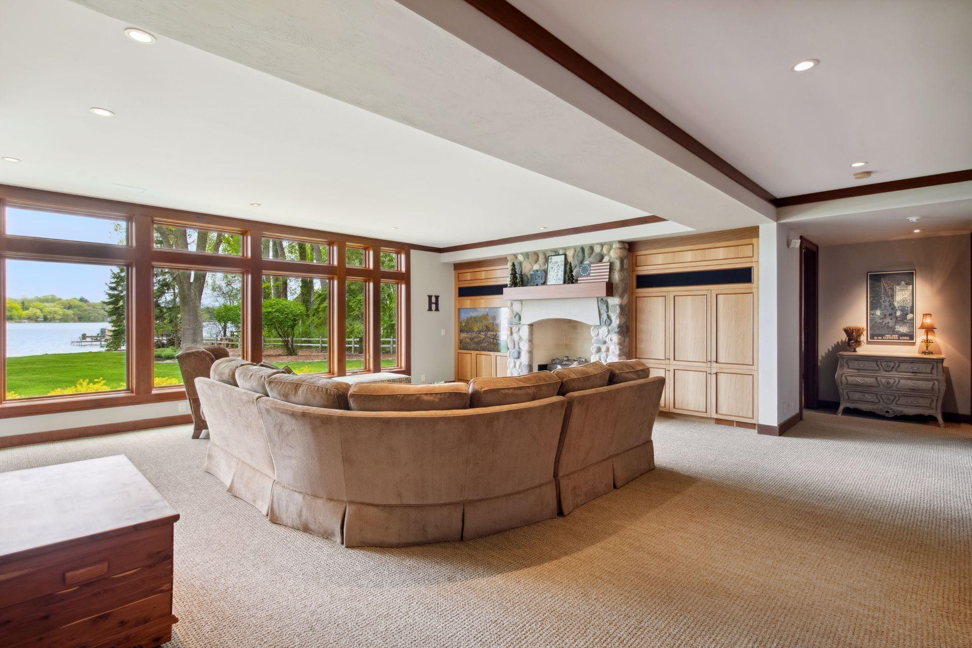 Welcome to the lower level walkout at 6941 Beach Road. You can feel the outdoors in this home due to all the floor to ceiling windows.