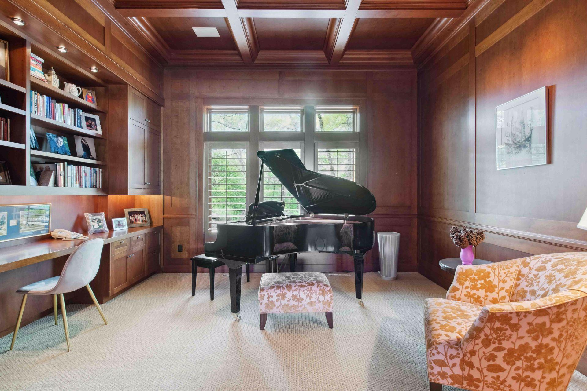 Main level luxury den/office with coffered ceiling. This is one of several options to work from home (the most formal office space) This is located off main level living room and 1st half powder bath.