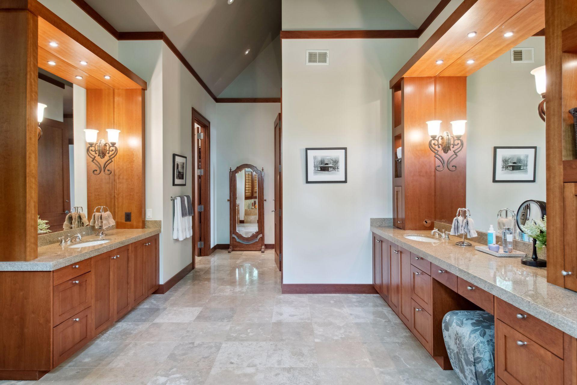 View from jacuzzi tub back towards entrance, private stool area on the right with primary walk in closet on the left.