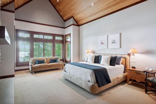 Main level primary that faces the water with 20ft soaring ceilings.