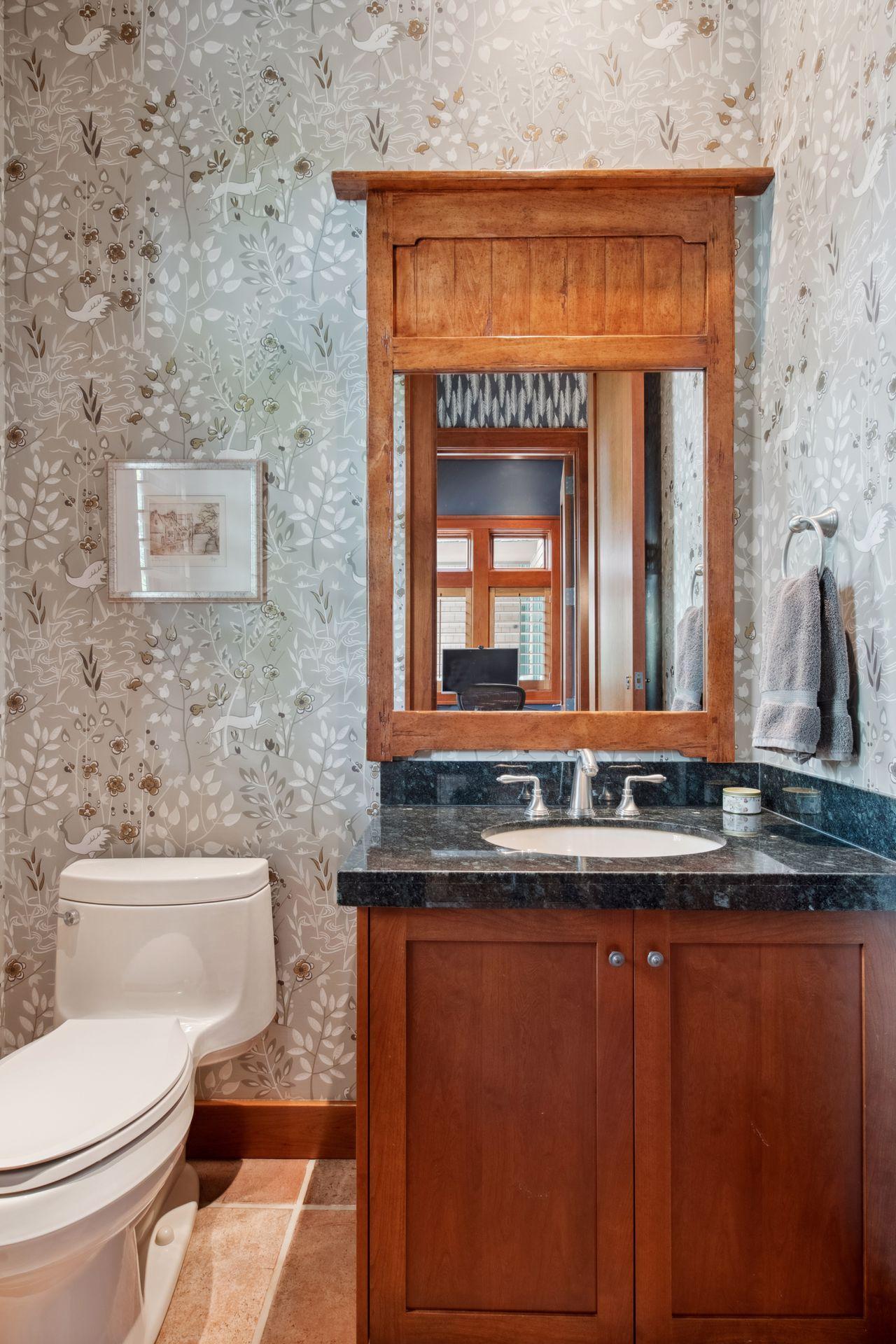 2nd Half powder bath directly across from 2nd private office area located in back hall from garage entry.