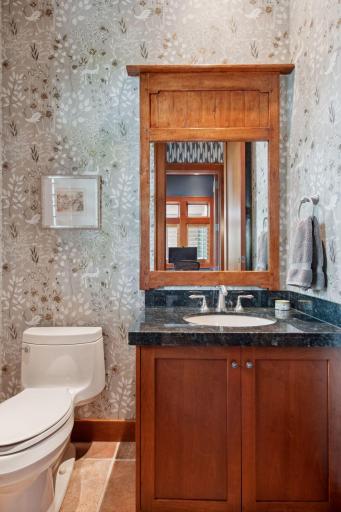2nd Half powder bath directly across from 2nd private office area located in back hall from garage entry.
