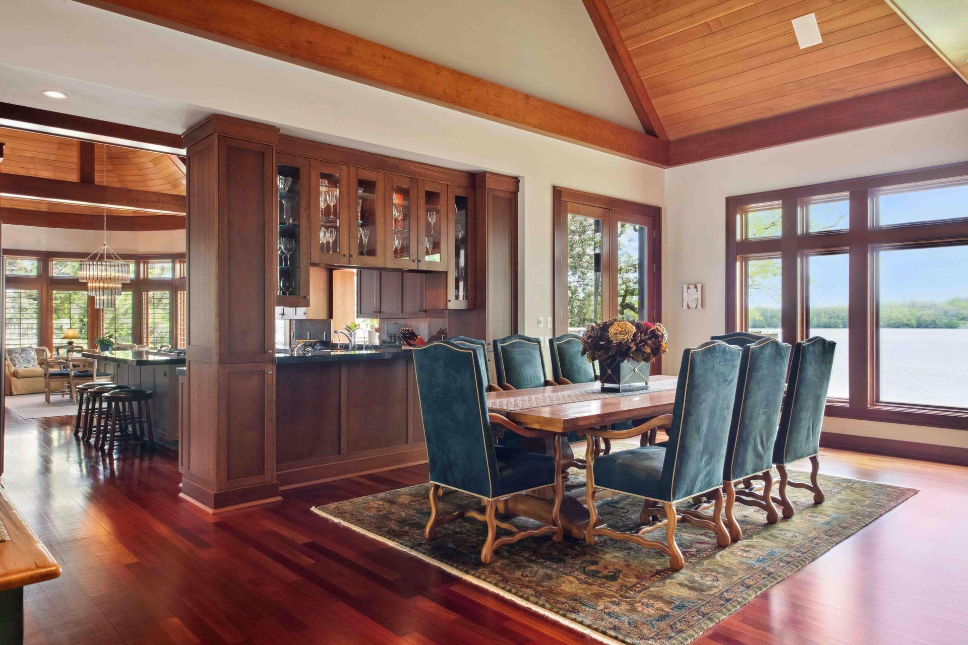 Formal dining with ease next to beautiful custom cabinetry to hold your glassware or china. Ask agent for more details as home has the option to be sold furnished.