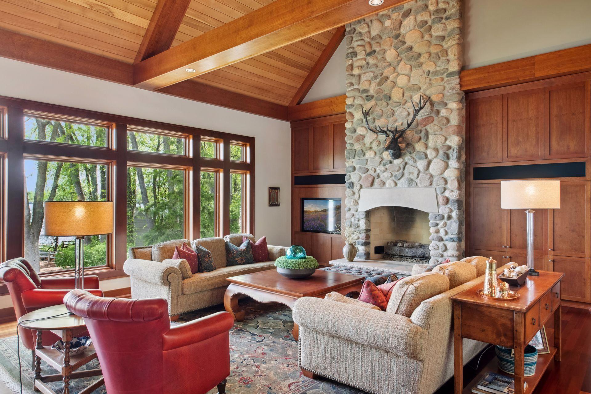 1 of 4 gas fireplaces to enjoy in your like new lake home. Main level floor to ceiling stone gas fireplace accents the exterior stone on this home.