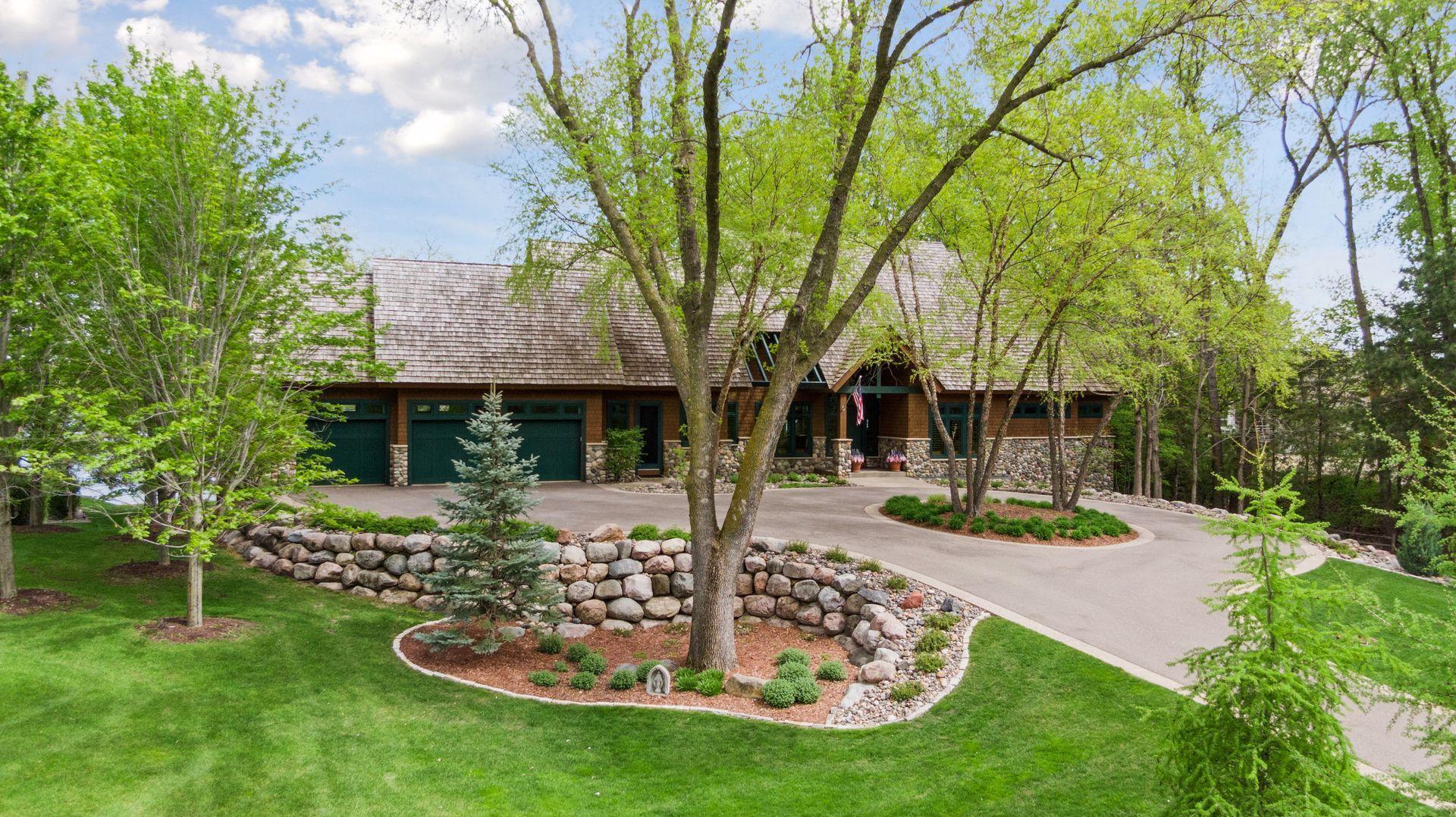 Three car heated garage on main level plus additional identical garage below with lake access for all toys and tons of storage.