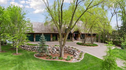 Three car heated garage on main level plus additional identical garage below with lake access for all toys and tons of storage.