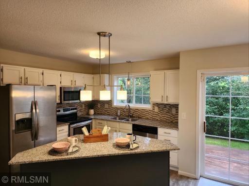 Kitchen-granite counters and tiled backsplash