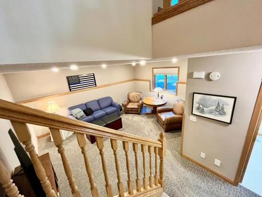 Stairs looking into lower level family room