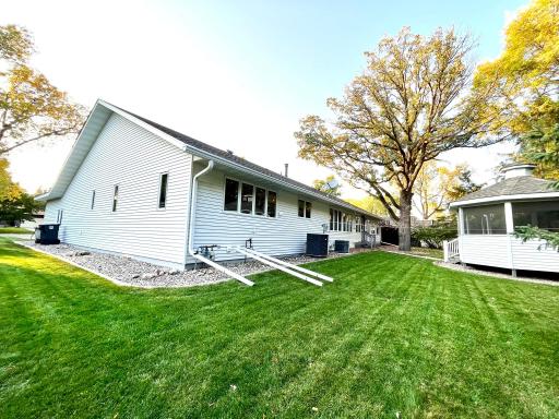 Backyard, underground sprinkler system, well-manicured lawn