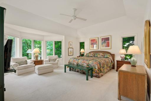 Large primary bedroom with two walk-in closets and a huge en suite