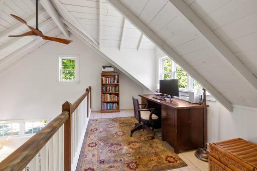 The loft space makes for a perfect office or reading nook.