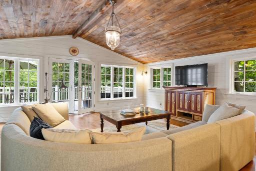 French doors lead out to the deck and backyard