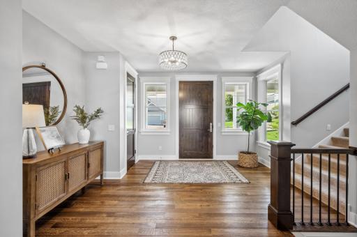 The interior showcases Marvin Integrity Windows throughout and white oak flooring on the main level including the great room, dining room and kitchen.