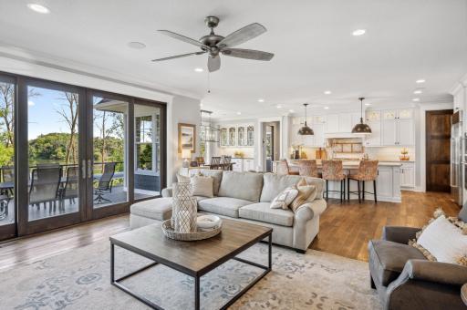 The open floor plan on the main floor seamlessly connects the great room, dining area, and gourmet kitchen, creating an expansive and inviting space perfect for both everyday living and entertaining.