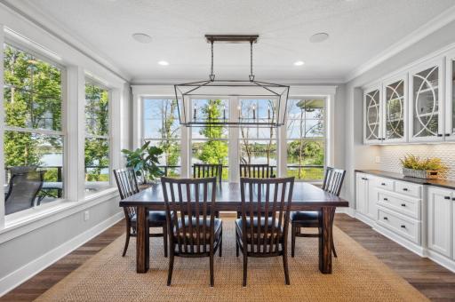The dining room exudes elegance with its custom-built hutch. This exquisite piece serves as a focal point, offering both display and storage, enhancing the room's sophisticated ambiance.