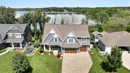 Experience luxury living at it's finest in this stunning two story situated in a quiet neighborhood on the shores of Wasserman Lake, offering breathtaking views.