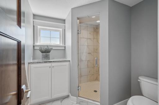 It features a private shower and toilet area for added privacy.