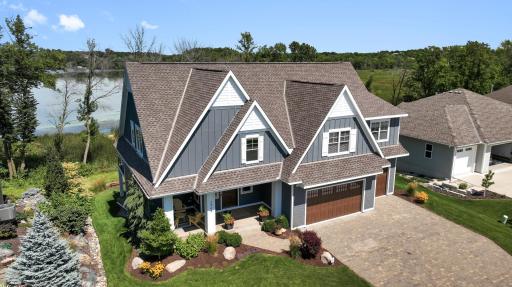 The paver sidewalk and driveway add a touch of elegance and durability to the homeâs exterior. The carefully laid pavers create a visually appealing and sturdy surface, enhancing curb appeal while offering a welcoming entrance.