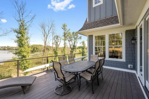 The expansive deck, crafted w/Aztek maintenance-free decking, offers a durable & stylish outdoor space perfect for relaxation & entertainment. Its low-maintenance design ensures lasting beauty, allowing you to enjoy the outdoors without the upkeep.