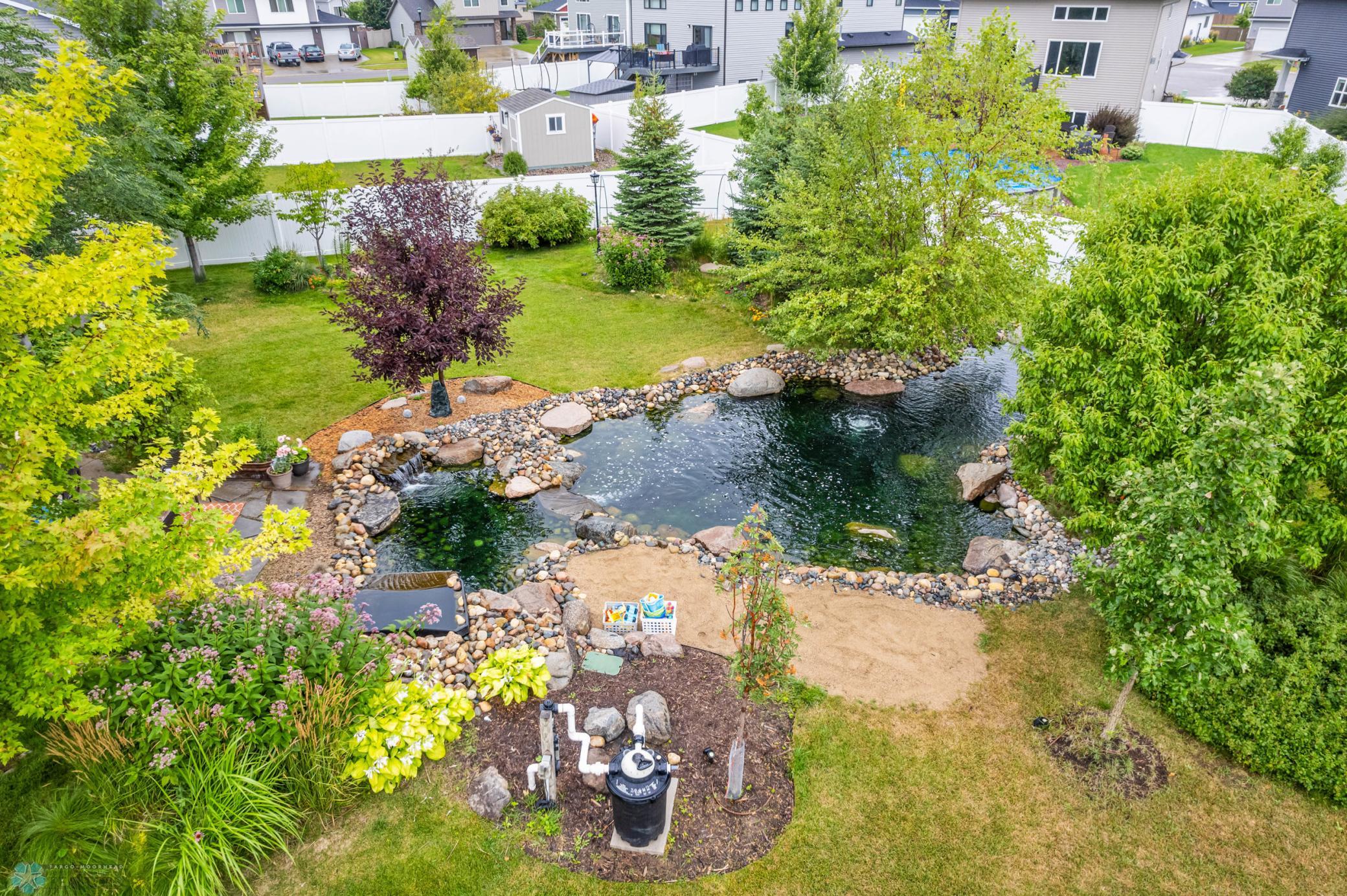 Custom Pond w/ waterfalls in Backyard