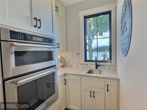 The butlers pantry even has views of the lakeshore complete with double oven, sink and tons of cabinet space.