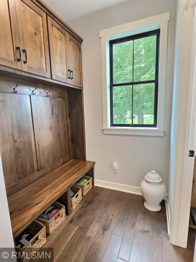 As you enter the home from the garage, the spacious back foyer with built-in locker system will greet you.