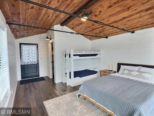 The bunkhouse is finished with built-in bunk beds, large closet and shiplap walls.