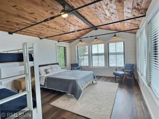 Vaulted ceilings, custom spindles for a fun accent and walls of windows invite family and friends to stay!