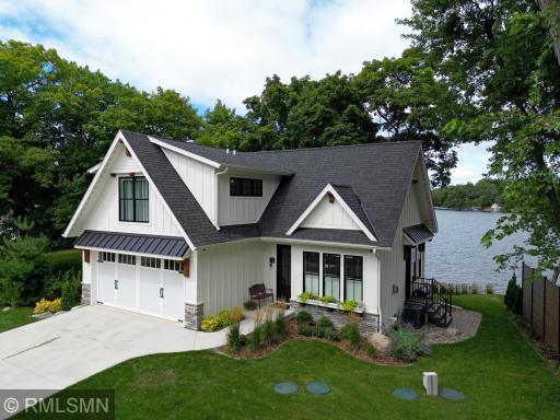 Situated along the Lake Sylvia peninsula, this completely custom home is calling you start your own cherished traditions.