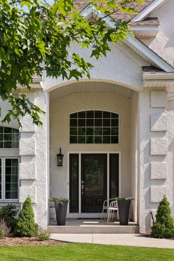 The elegant entry includes an updated door and beautiful transom window!